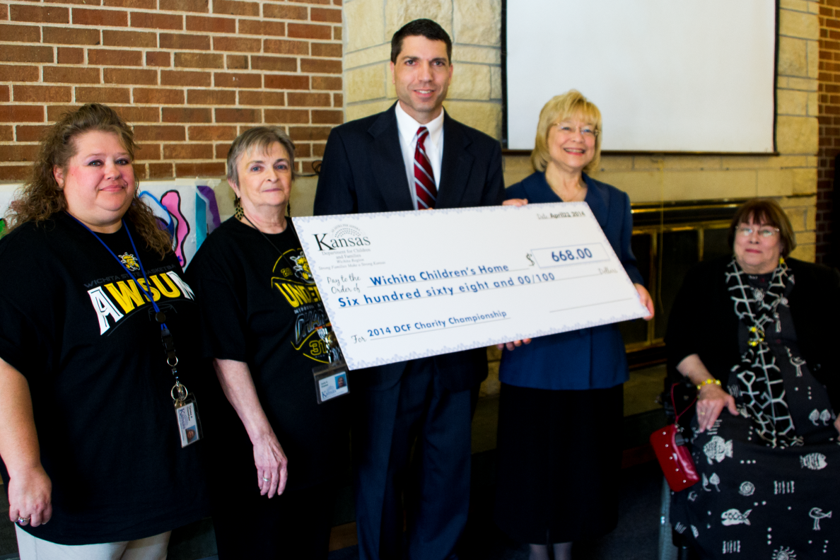 Wichita DCF employees present check to Wichita Children’s Home